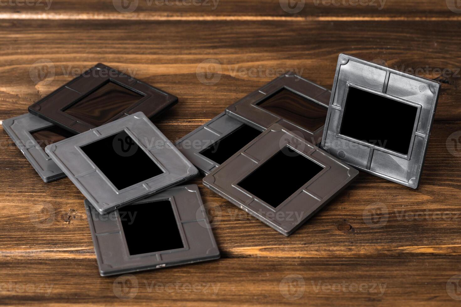 Photography empty slide frames on wooden background photo