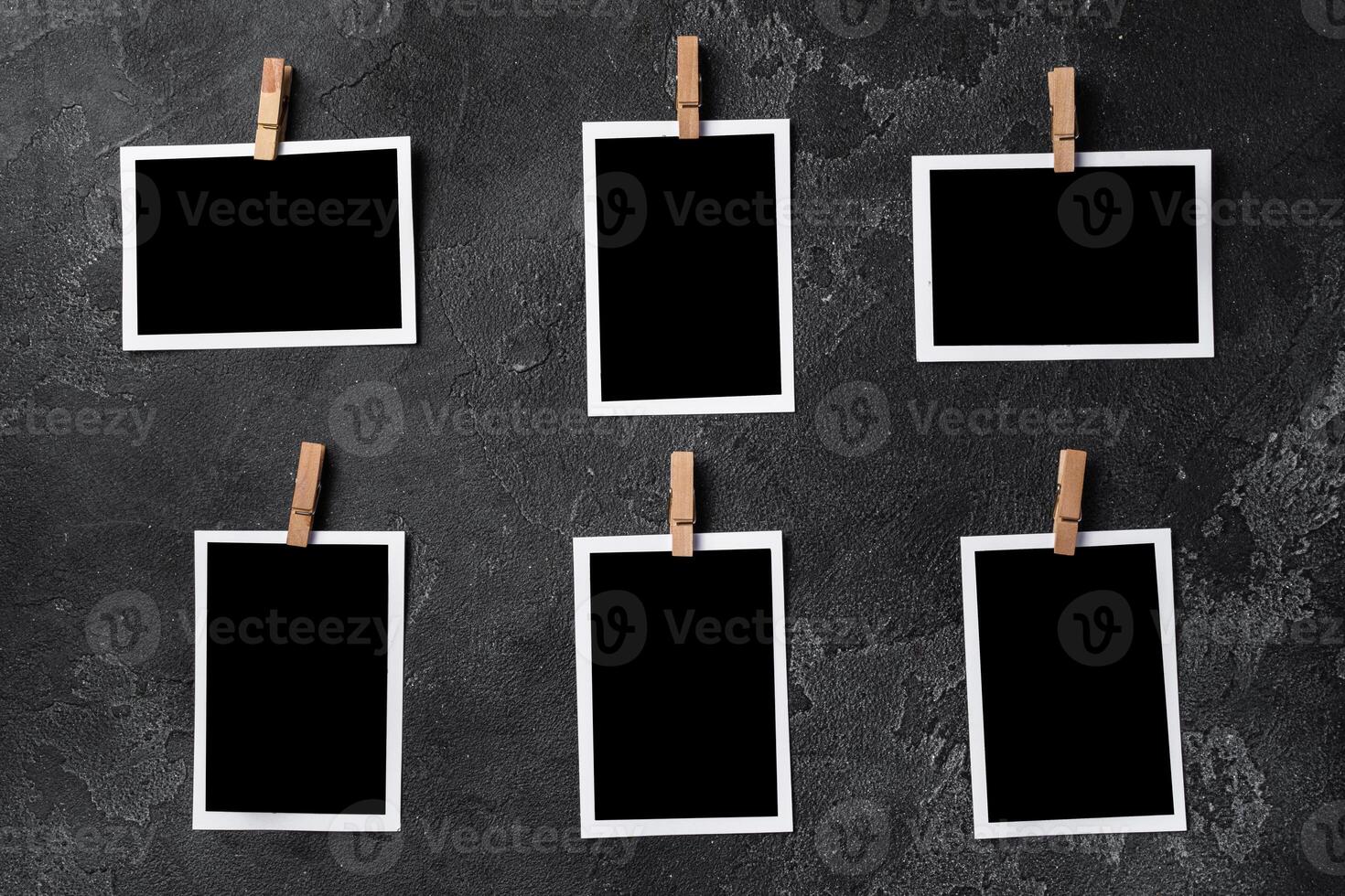Paper photo frames with blank space on gray textured background