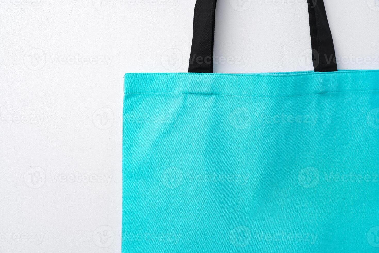 Empty fabric shopping bag on white background photo