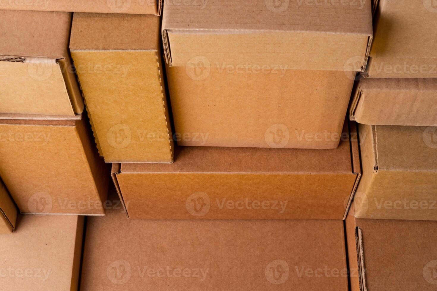 Cardboard boxes stacked in a pile as a background photo
