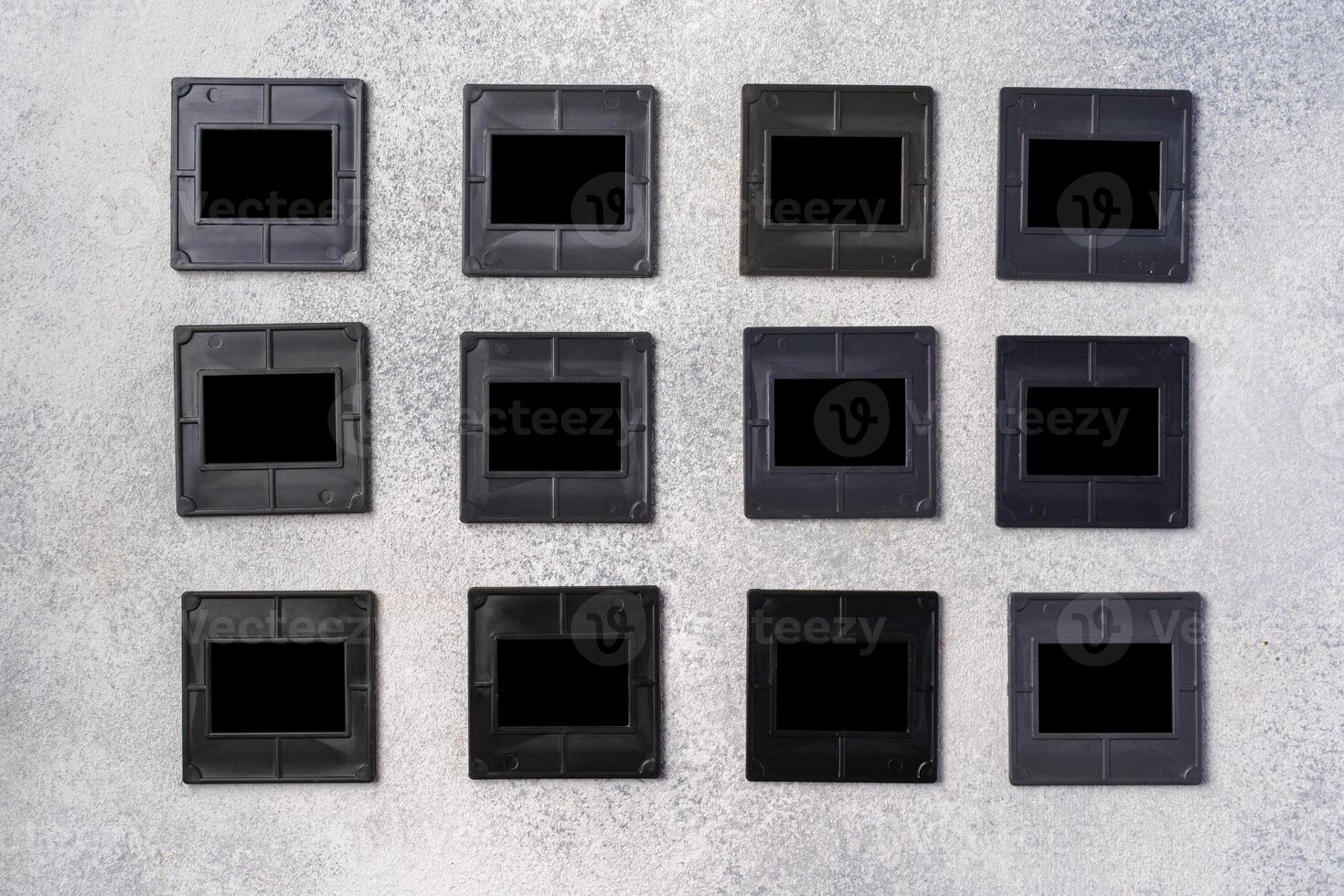 Photography empty slide frames on gray background photo