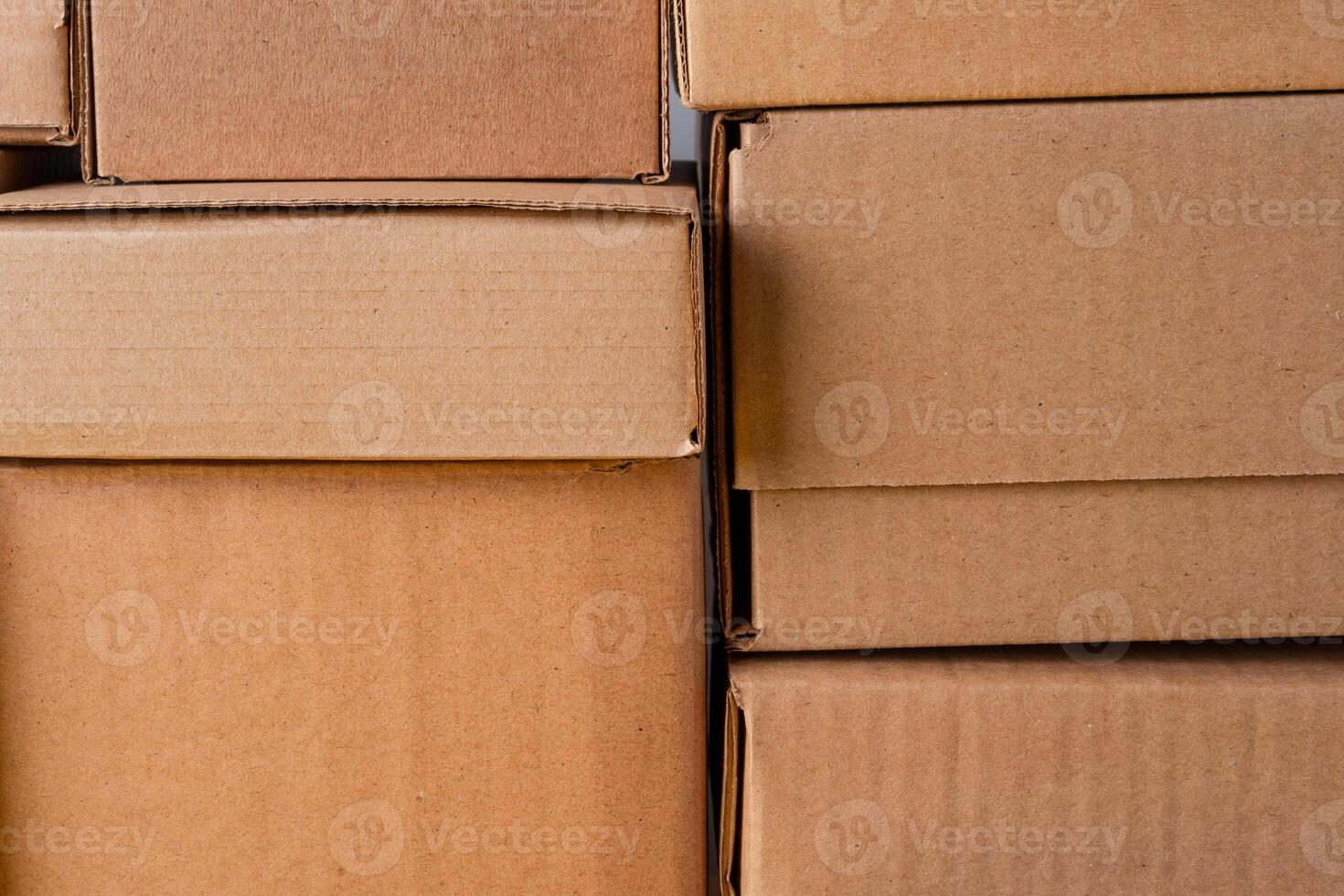 Cardboard boxes stacked in a pile as a background photo