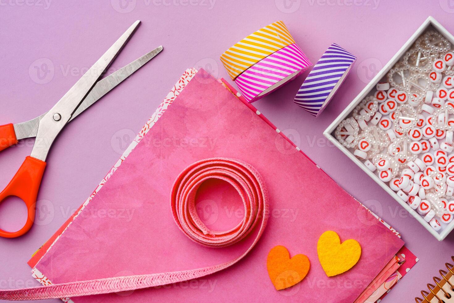 Crafting supplies on a purple background ready for creative projects photo