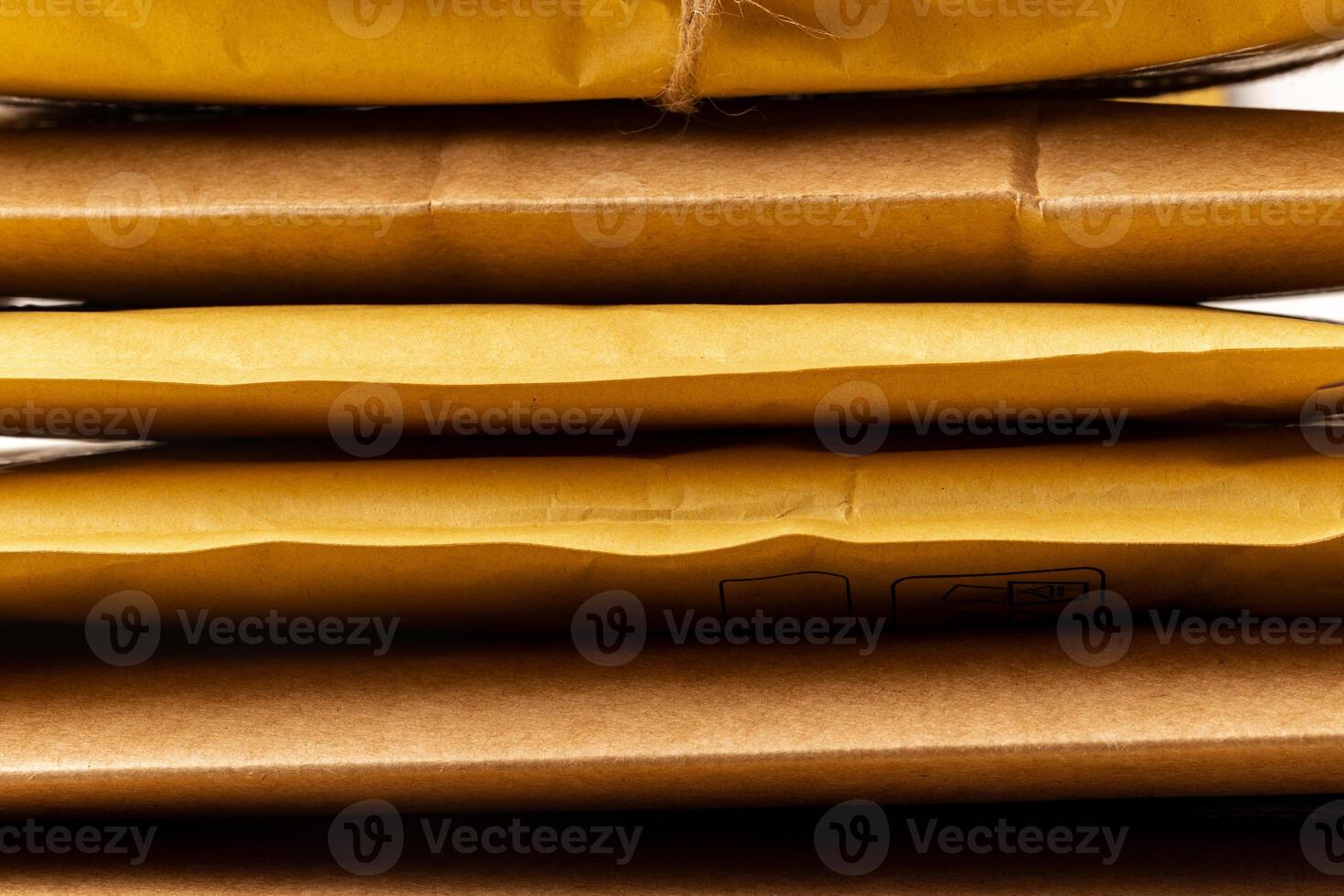 Close up shot of stack of padded mailing envelopes photo