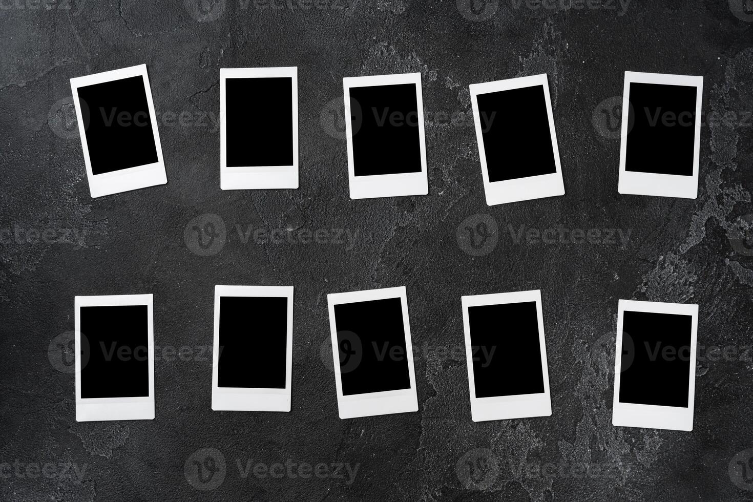 Paper photo frames with blank space on gray textured background
