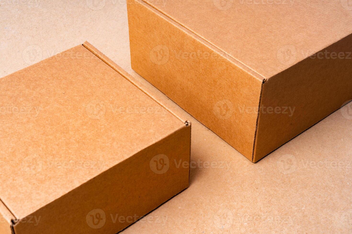Cardboard box on beige background in studio photo