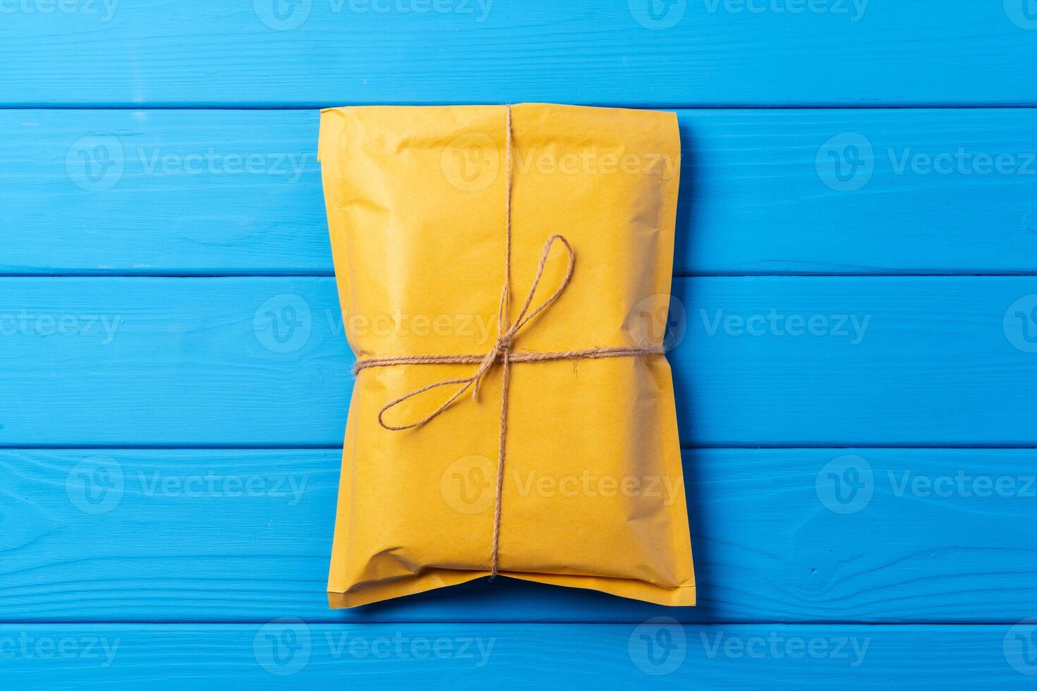Lot of yellow paper postal envelopes. Top view. photo