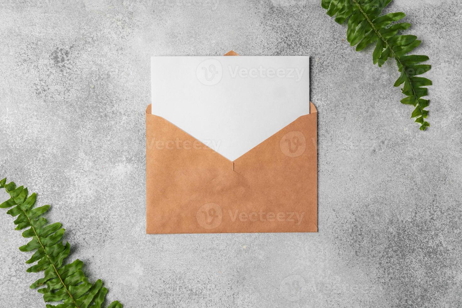envelope and blank paper card with copy space mock up. photo