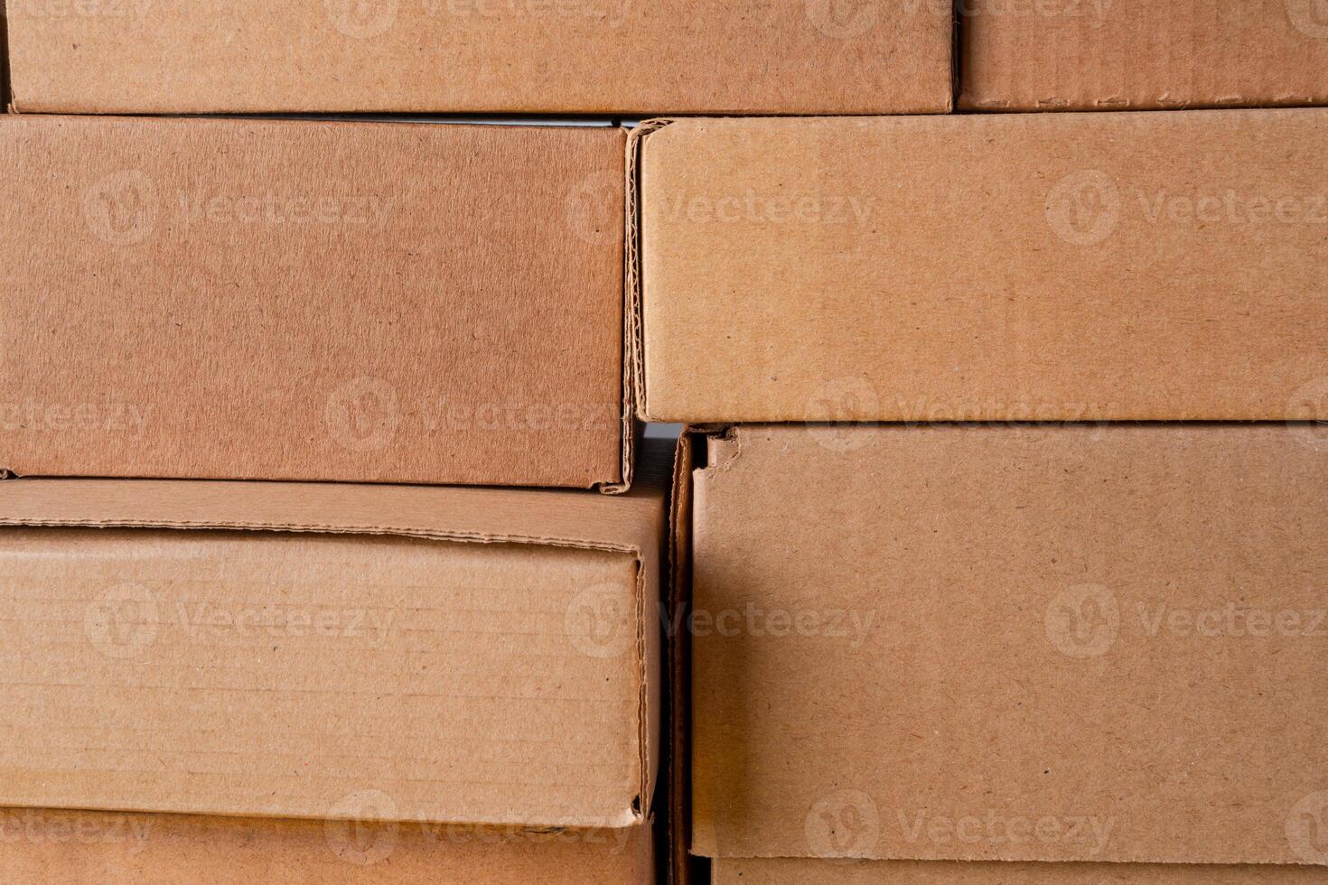 Cardboard boxes stacked in a pile as a background photo