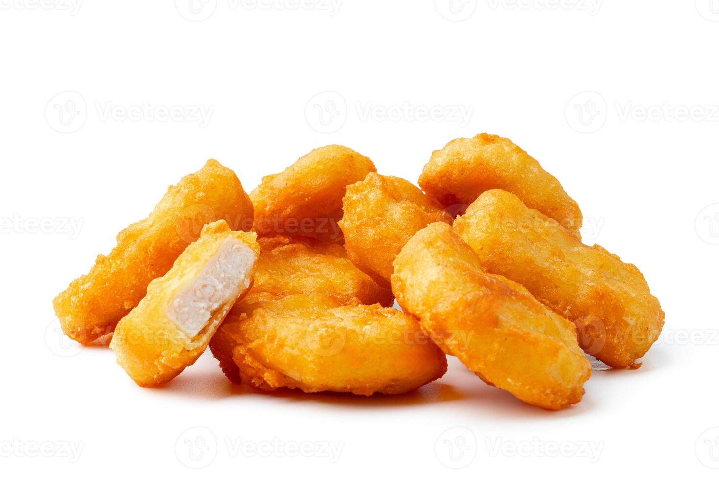 Pile of fried chicken nuggets isolated on white photo