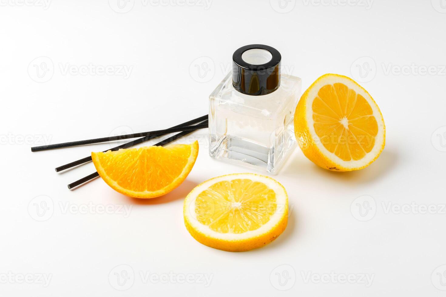 Aromatic display of essential oils with citrus fruit and chopsticks on a minimalist background photo