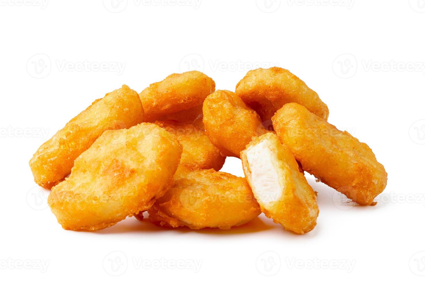 Pile of fried chicken nuggets isolated on white photo