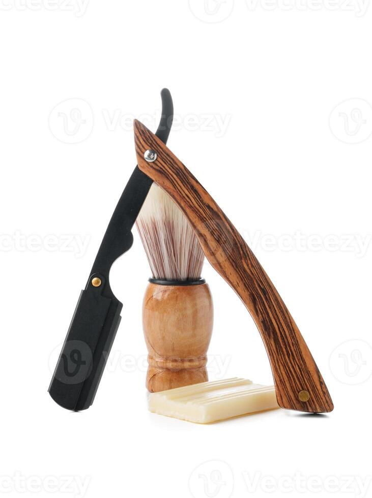 Vintage shaving razor and tools isolated on white photo