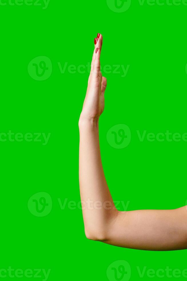 Womans Arm Hand Sign Raised in the Air photo