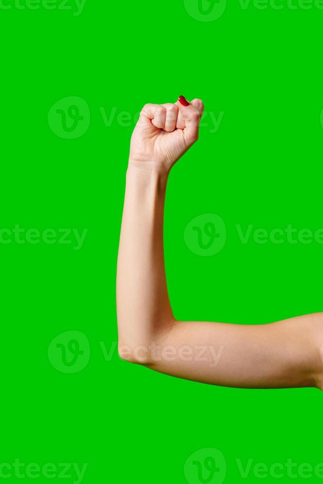Womans Arm Hand Sign Raised in the Air photo