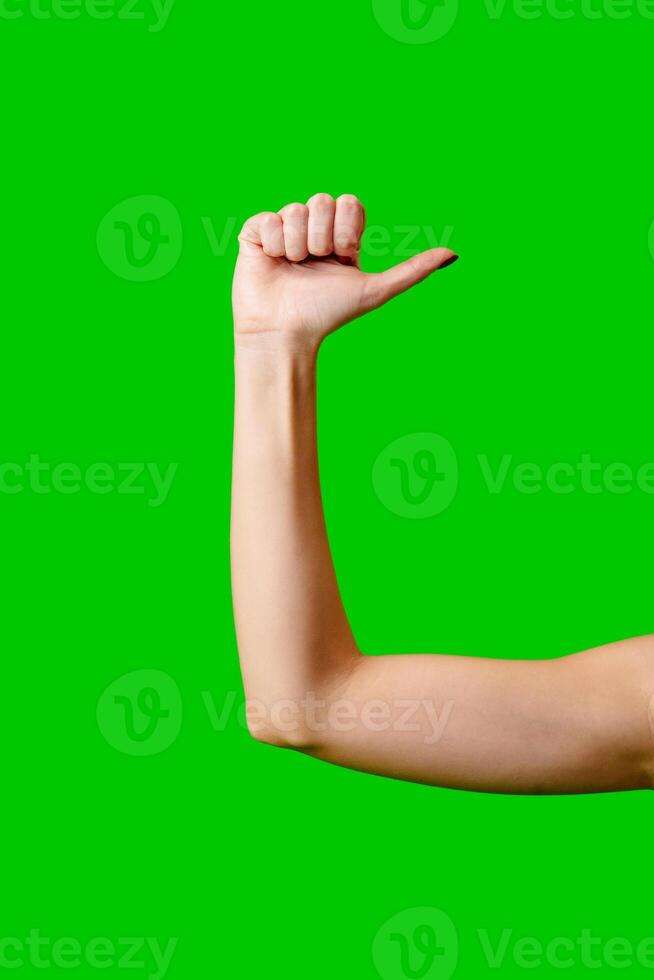 Womans Arm Hand Sign Raised in the Air photo