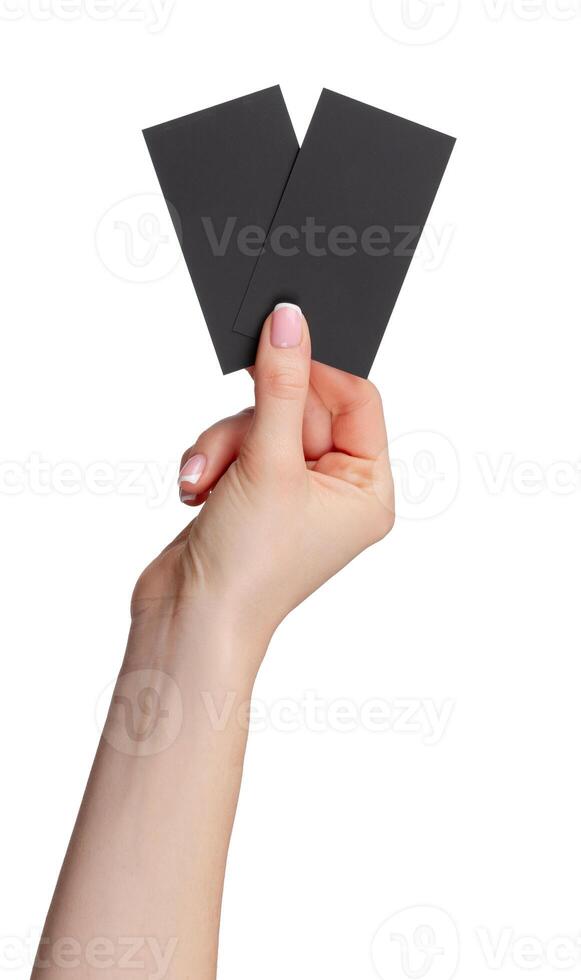 Female hand holding black businesscard isolated on white background photo