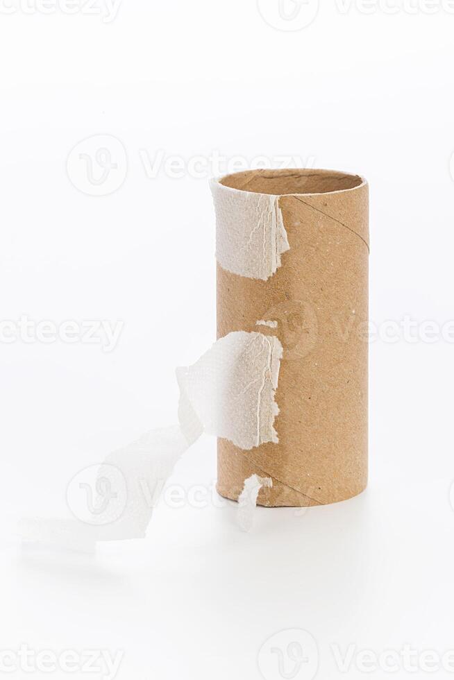 Empty toilet paper on white background photo