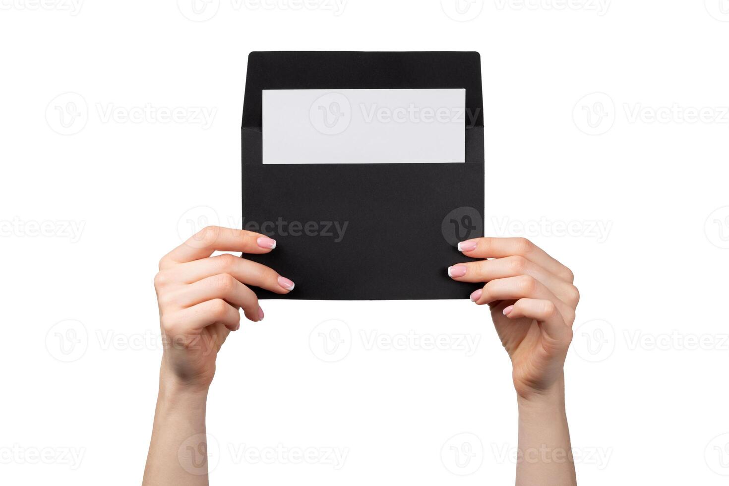 Female hand with manicure holding envelope isolated on white photo