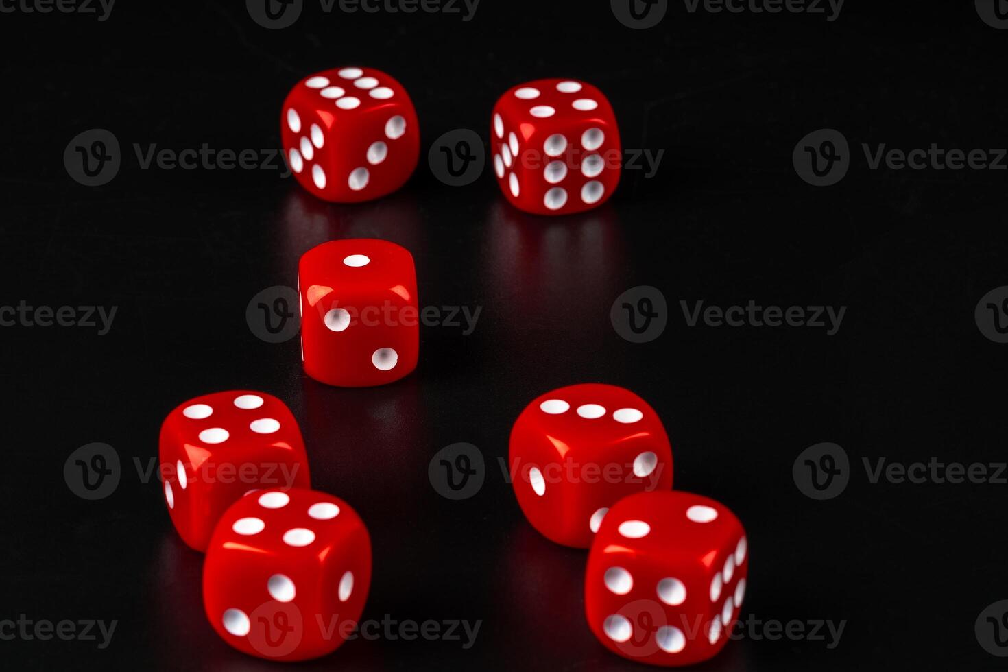 Group of dice close up on dark black background photo