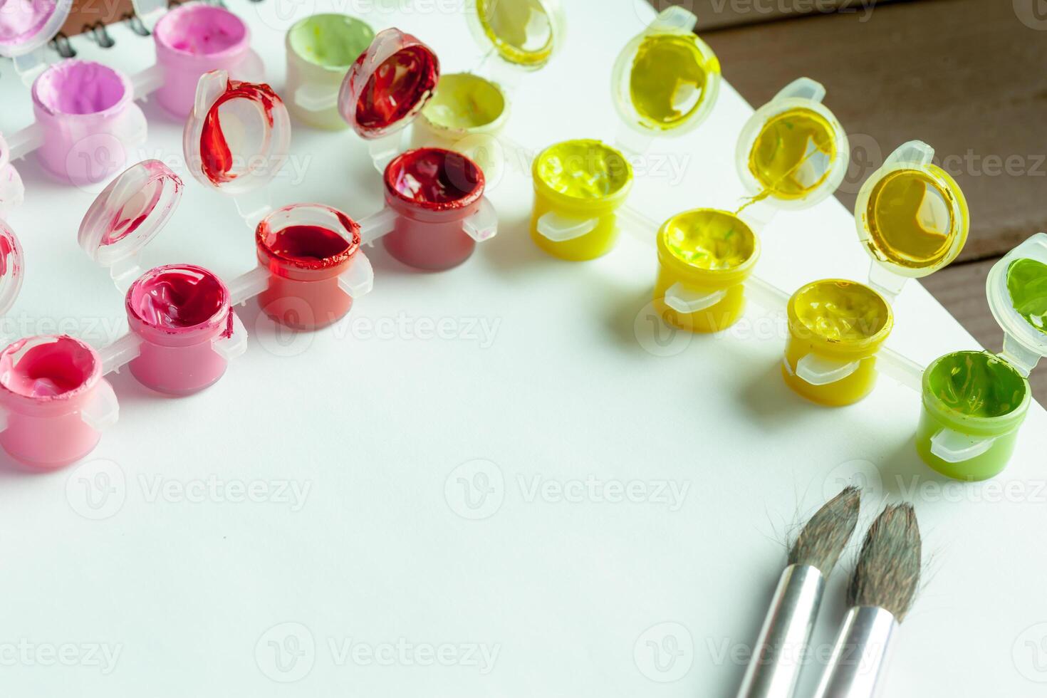 set of brightly colored acrylic paint photo
