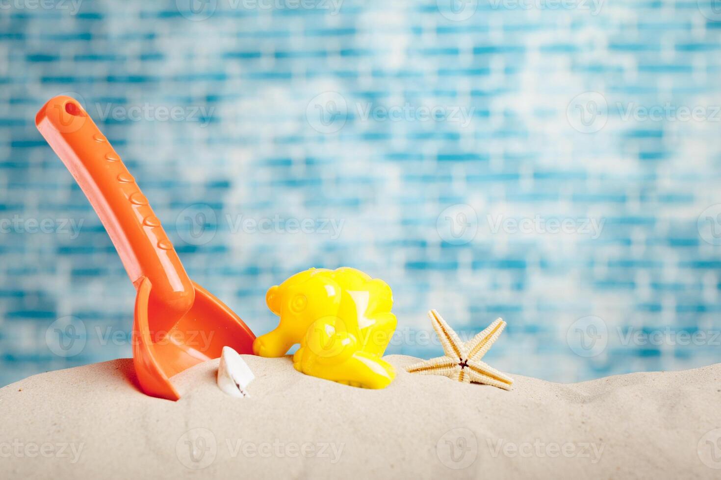 Children's toys on sand photo