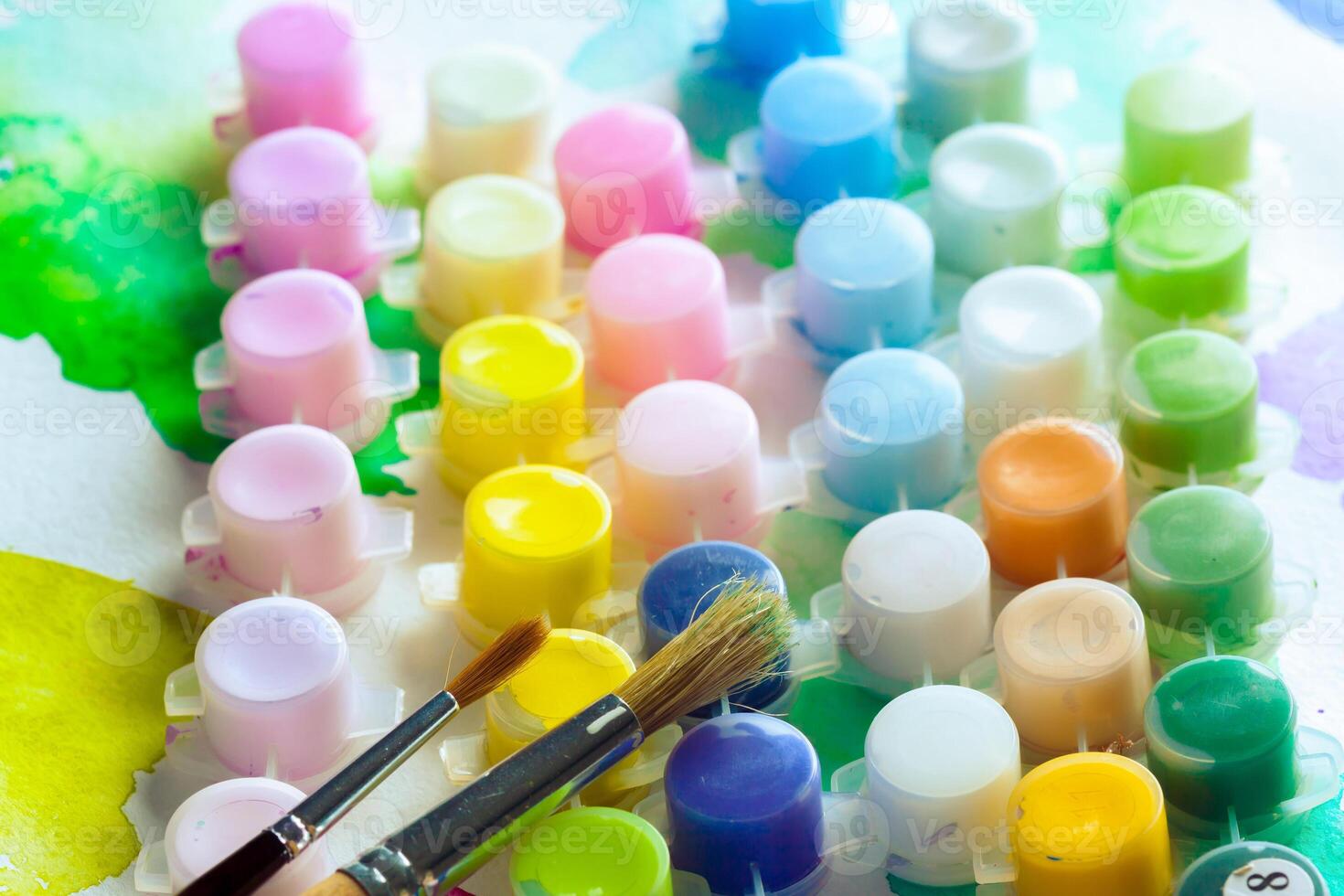 Set of watercolor paints and paintbrushes for painting photo