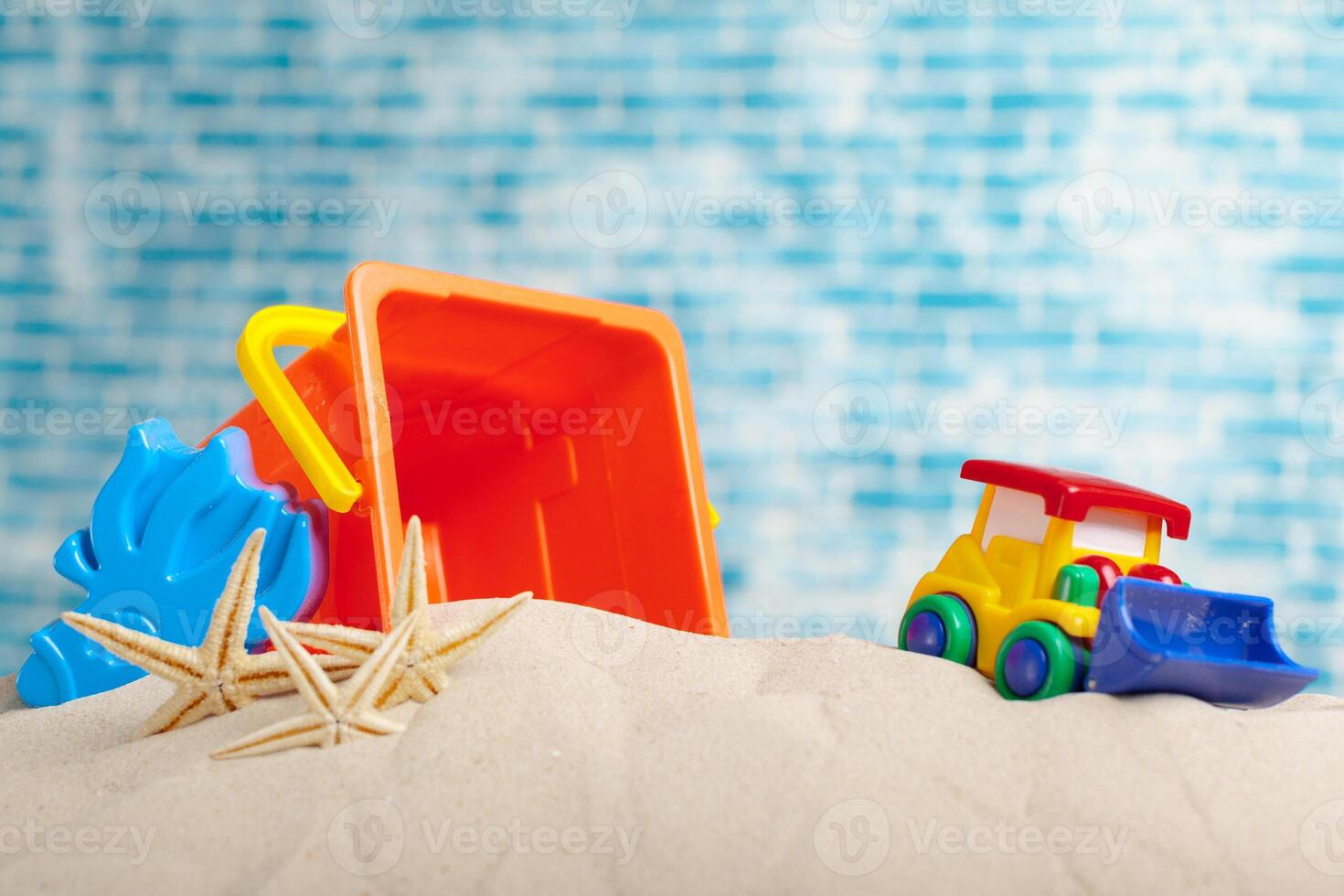 Children's toys on sand photo