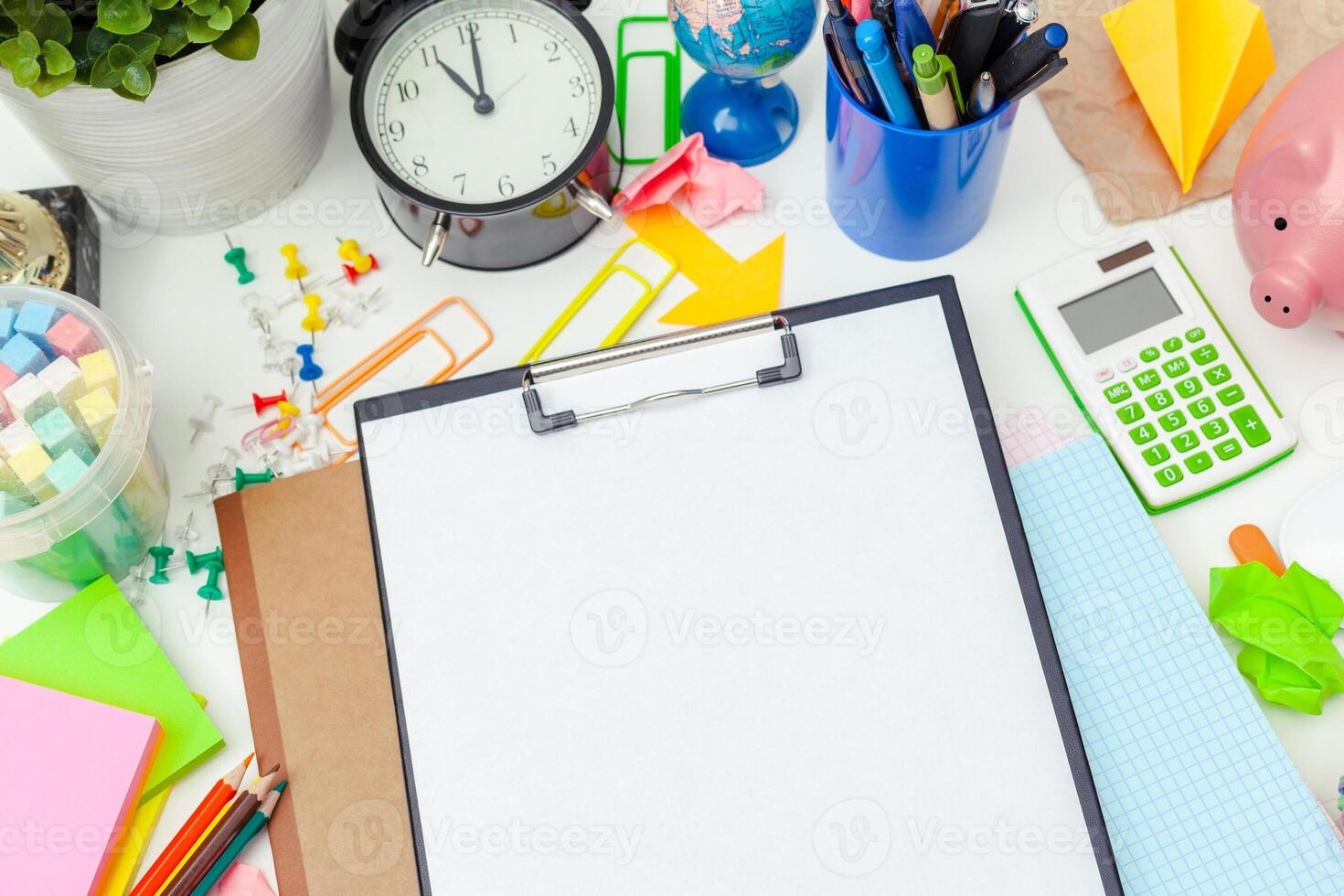 Work place of a creative person with a variety of colorful stationery objects photo