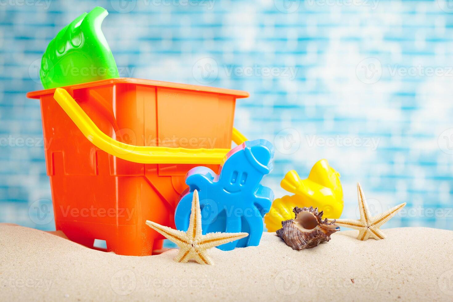 Children's toys on sand photo