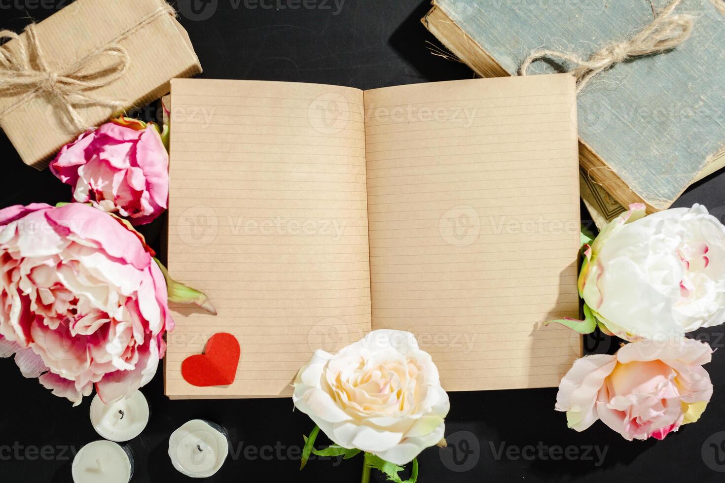 flowers with empty vintage notebook for your design photo