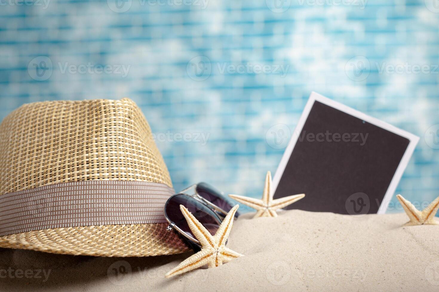 photo frames on the beach with seashells around