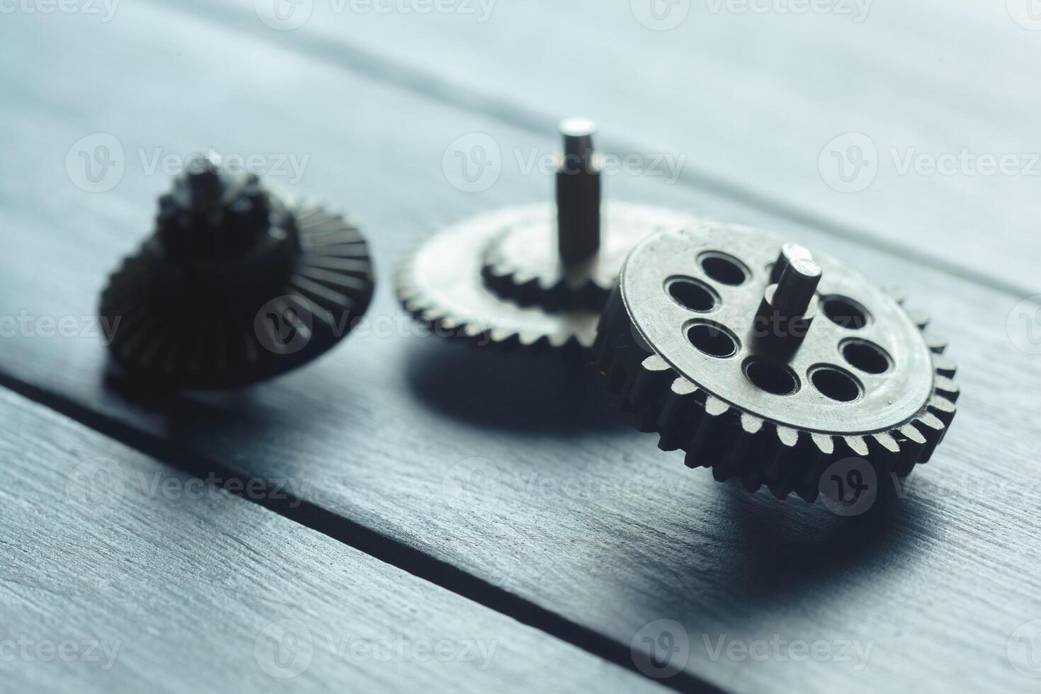 gears on the dark wooden background photo