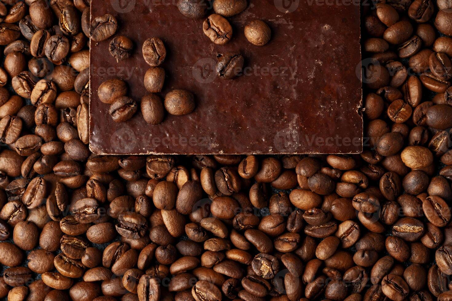 roasted coffee beans with black chocolate photo