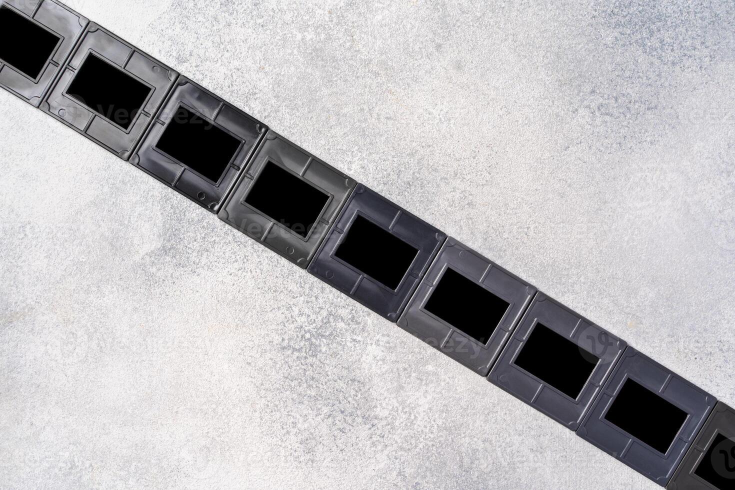 Photography empty slide frames on gray background photo