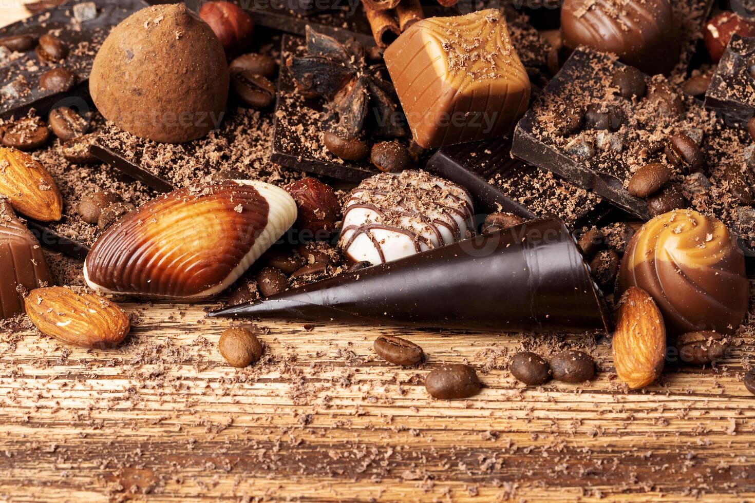 chocolate, cocoa, nuts and spices on wooden background photo