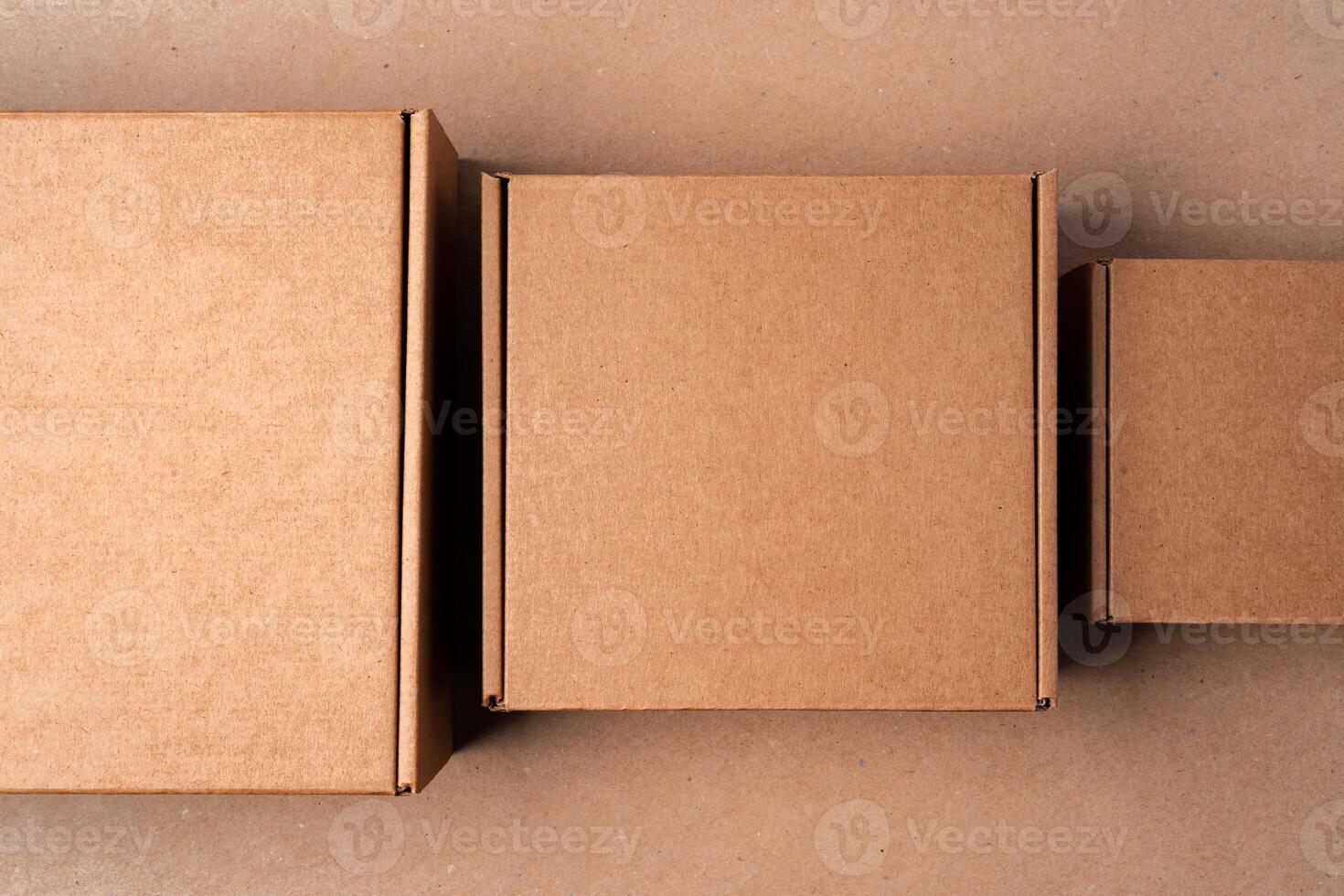 Cardboard box on beige background in studio photo
