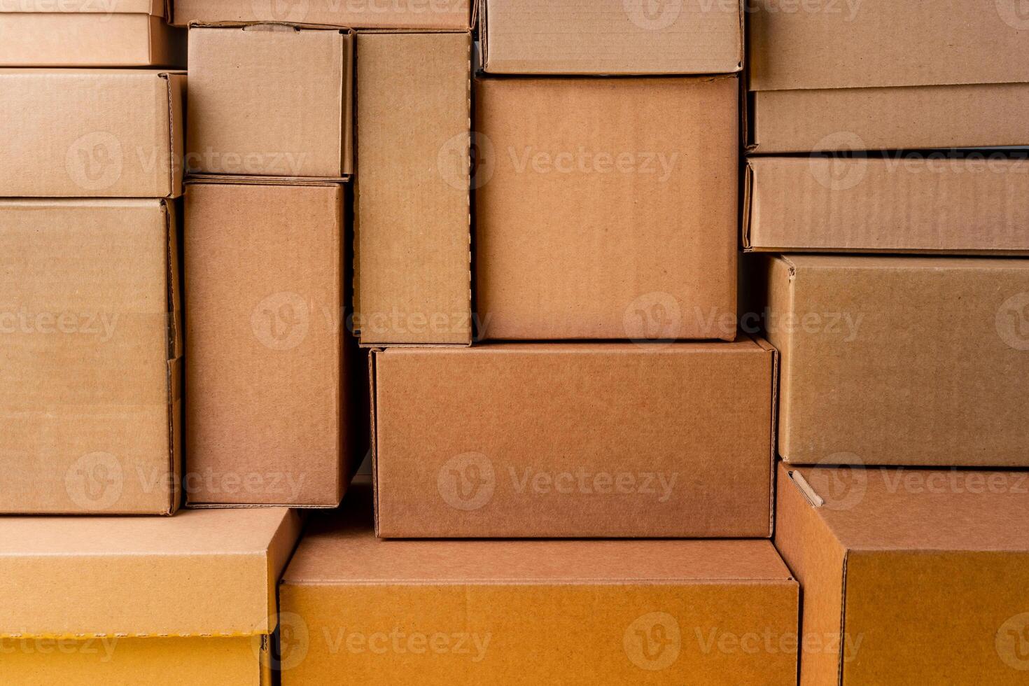 Cardboard boxes stacked in a pile as a background photo