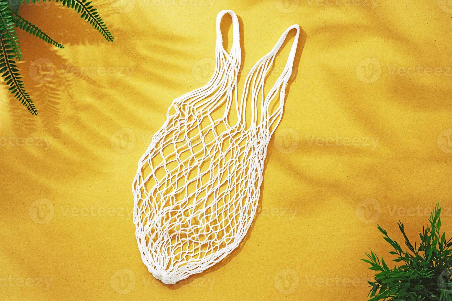Empty string reusable bag on paper background, top view photo