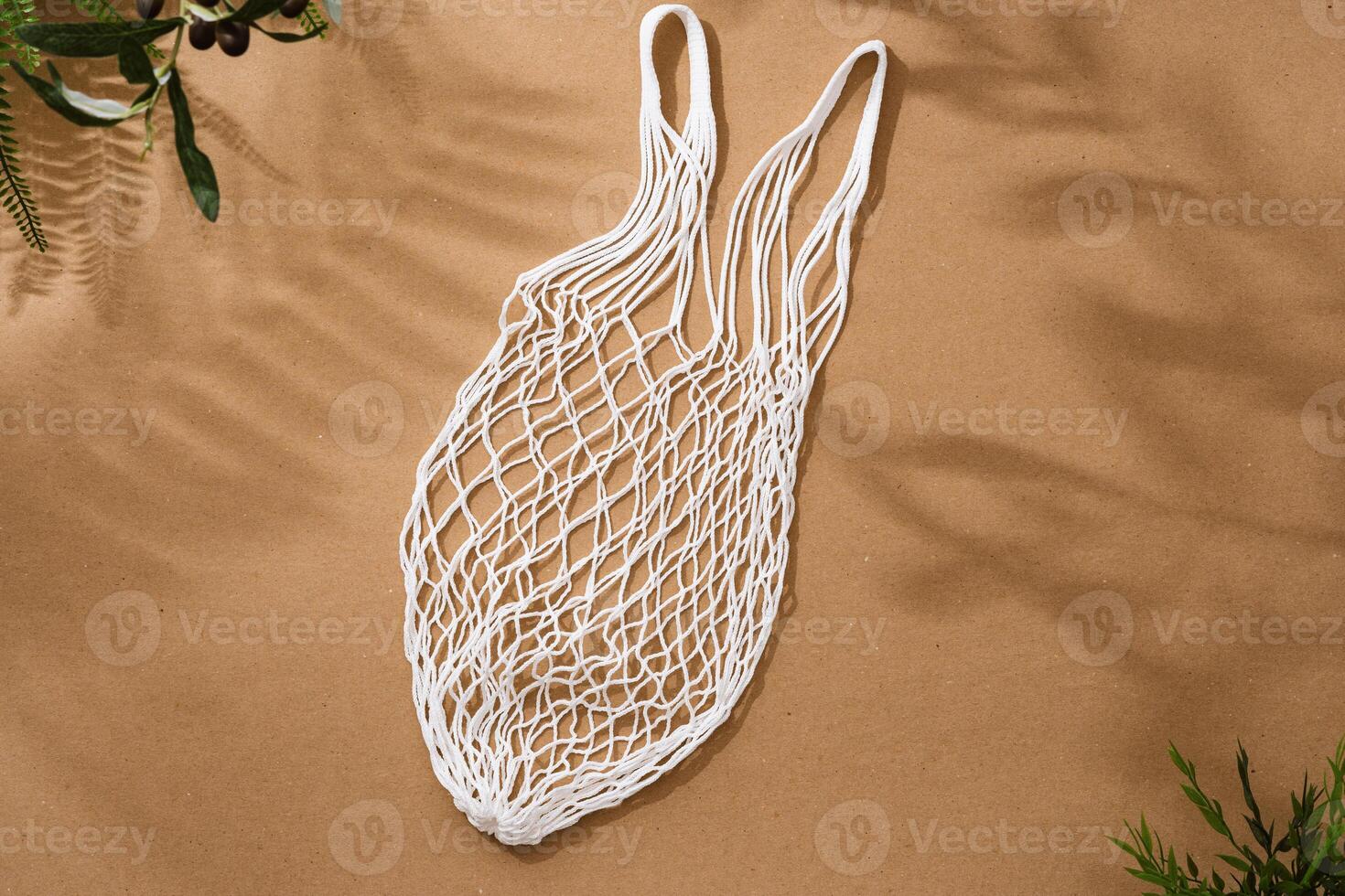 Empty string reusable bag on paper background, top view photo