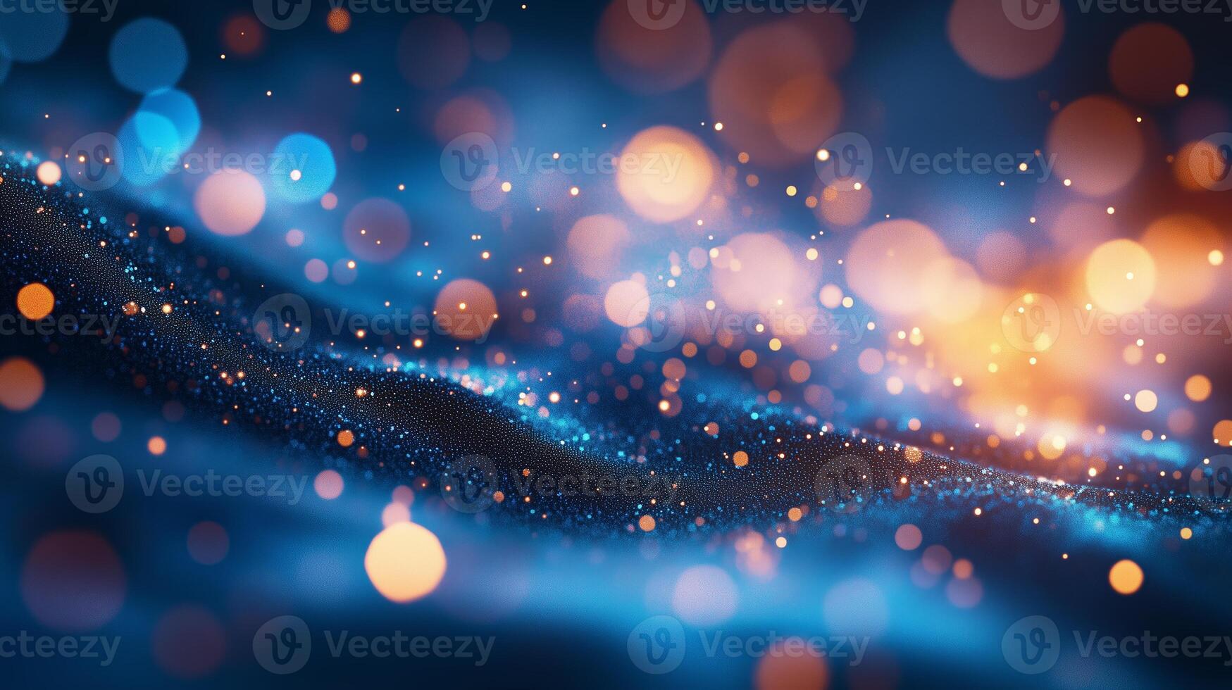 Soft glowing particles dance across a blue canvas in a mesmerizing abstract display of light and color photo