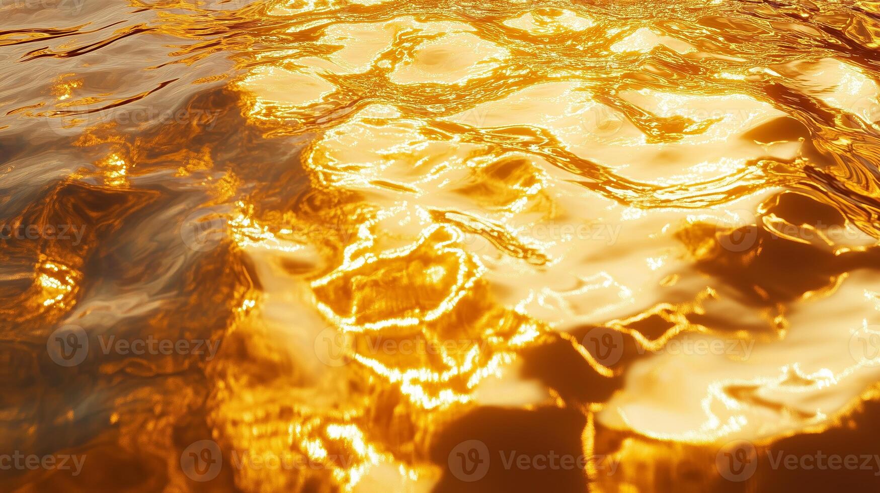 Golden sunlight reflects on calm water creating a mesmerizing shimmering effect during late afternoon hours by the lakeside photo