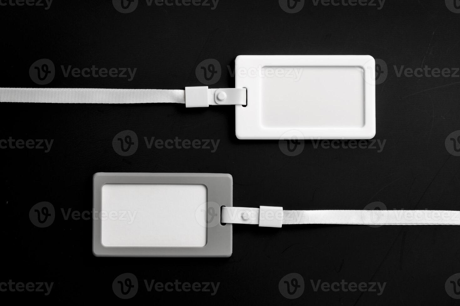 Blank badges on black background top view photo