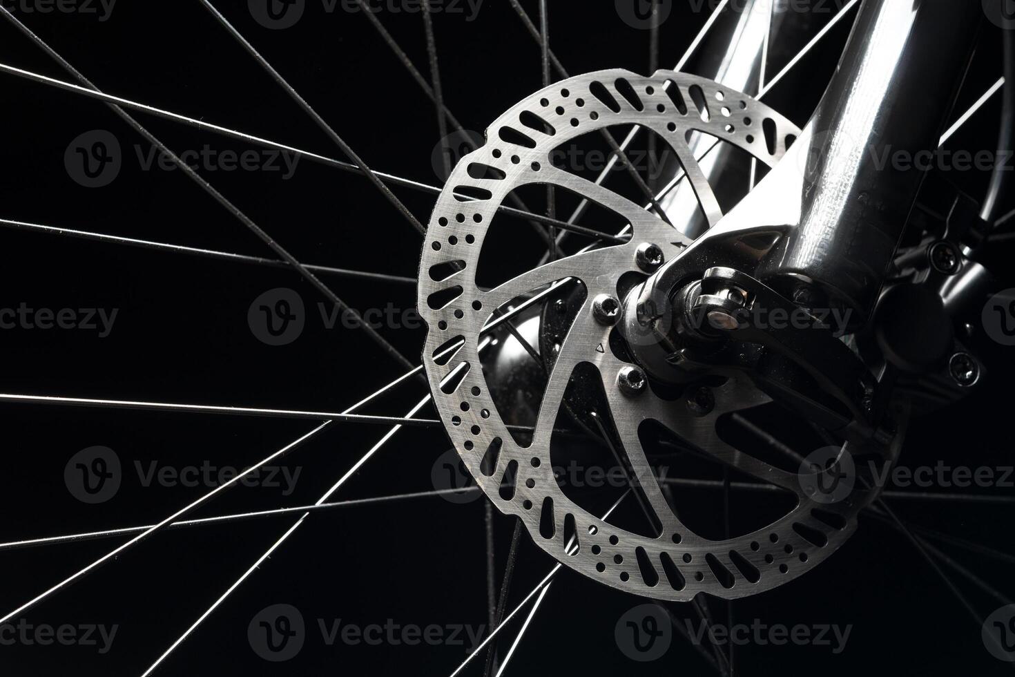 New bicycle chain part close up on black background photo