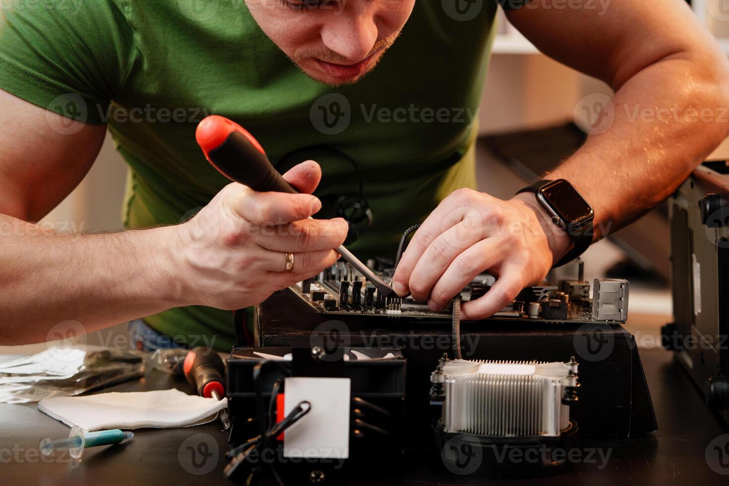 Close up of man repairing computer system unit photo