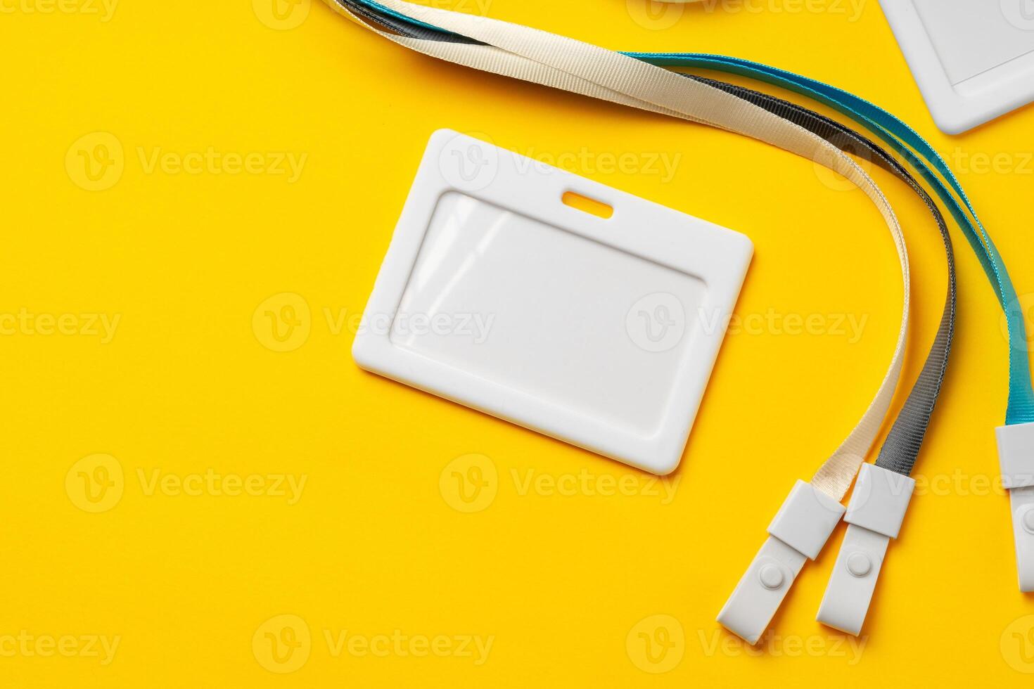 Blank badge with string on yellow background photo