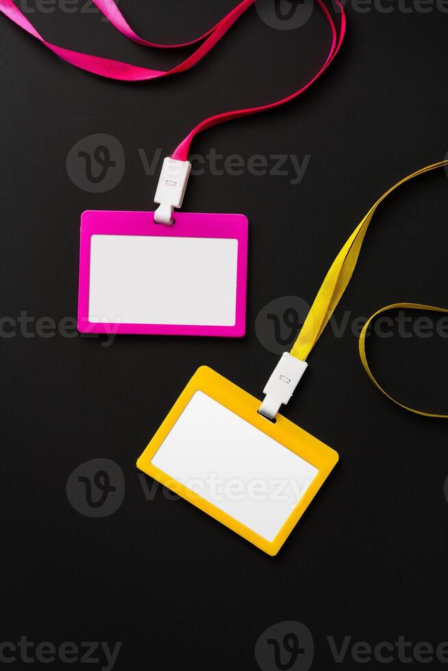 Blank badges on black background top view photo
