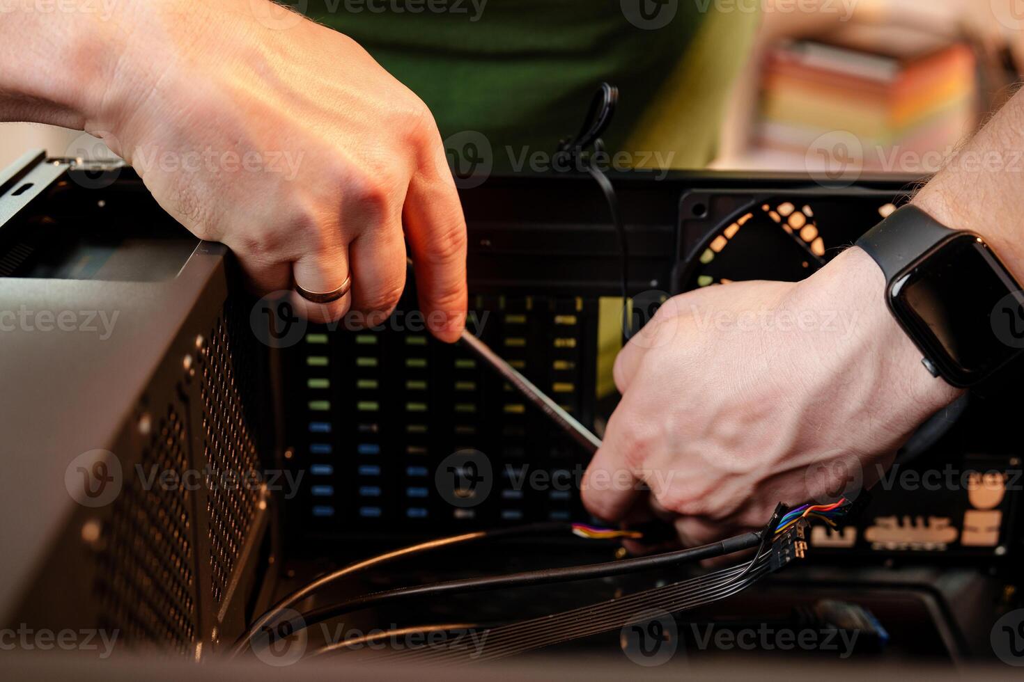 Close up of man repairing computer system unit photo