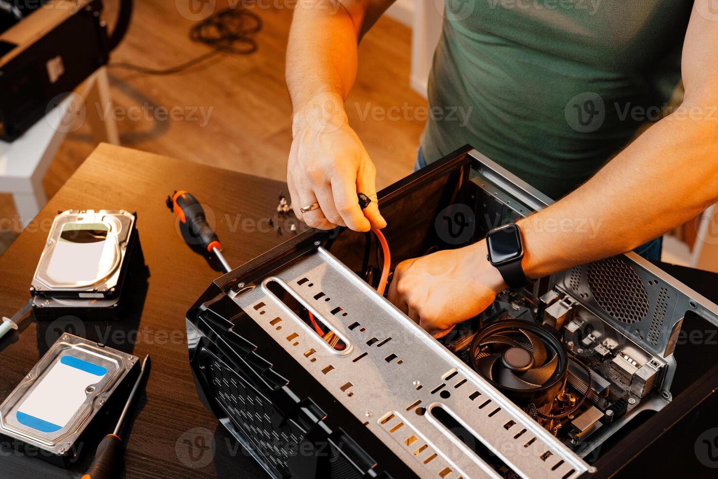 Close up of man repairing computer system unit photo