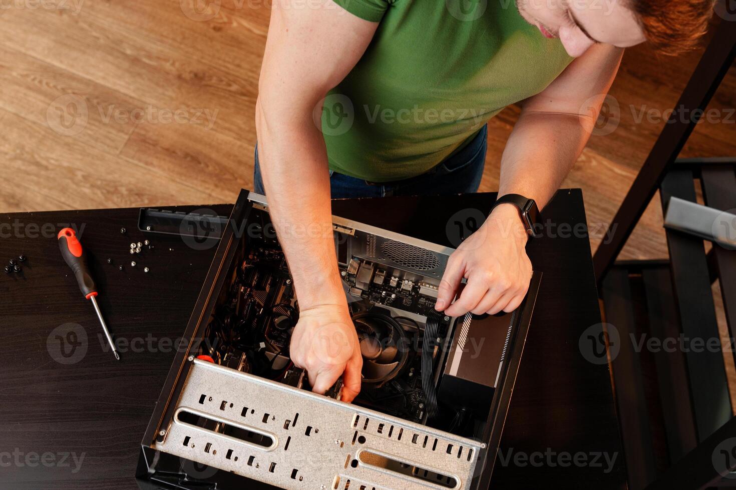 Close up of man repairing computer system unit photo